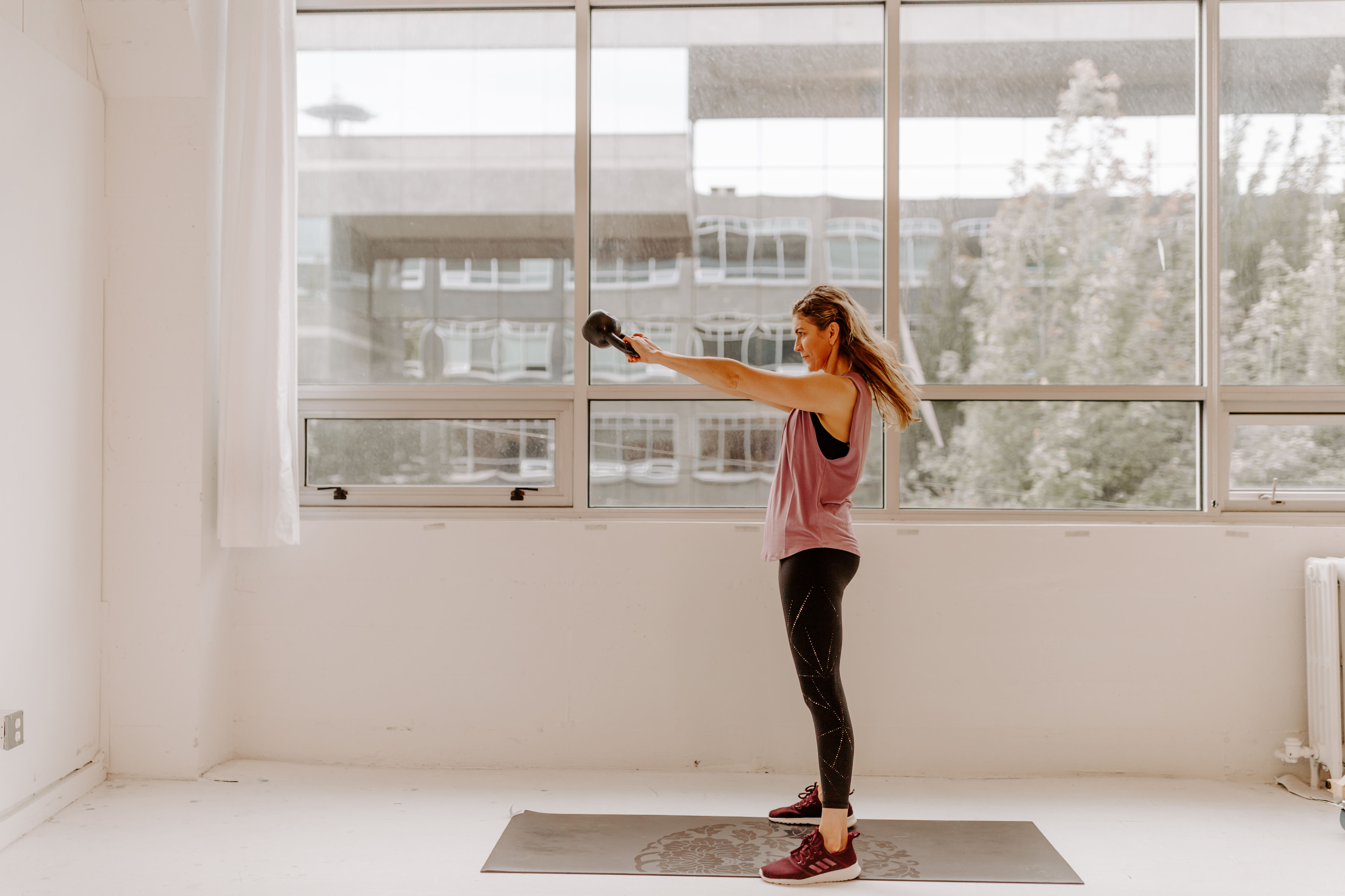 Michelle Spore mid-motion in a kettlebell swing