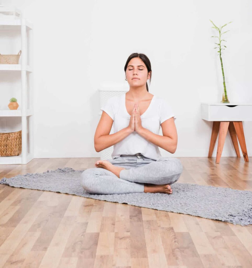 woman at home doing yoga